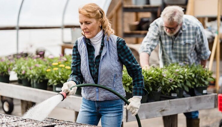 Photo by Greta Hoffman - Senior couple working in greenhouse