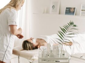 Photo by Ivan Samkov - A Dermatologist Applying Facial Mask on Customer's Face