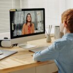 Photo of Child Sitting by the Table While Looking at the Imac - getting tips to overcome exam anxiety