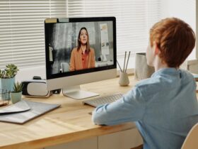 Photo of Child Sitting by the Table While Looking at the Imac - getting tips to overcome exam anxiety