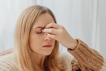 Woman holding her head, showing emotional stress and the need for support or help
