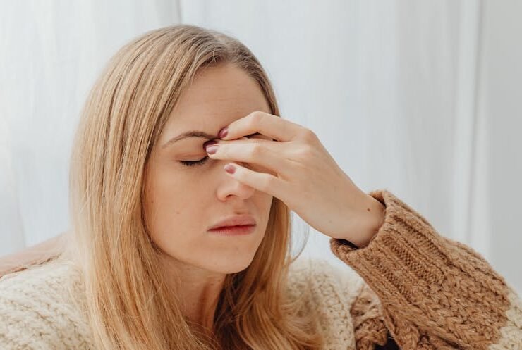 Woman holding her head, showing emotional stress and the need for support or help