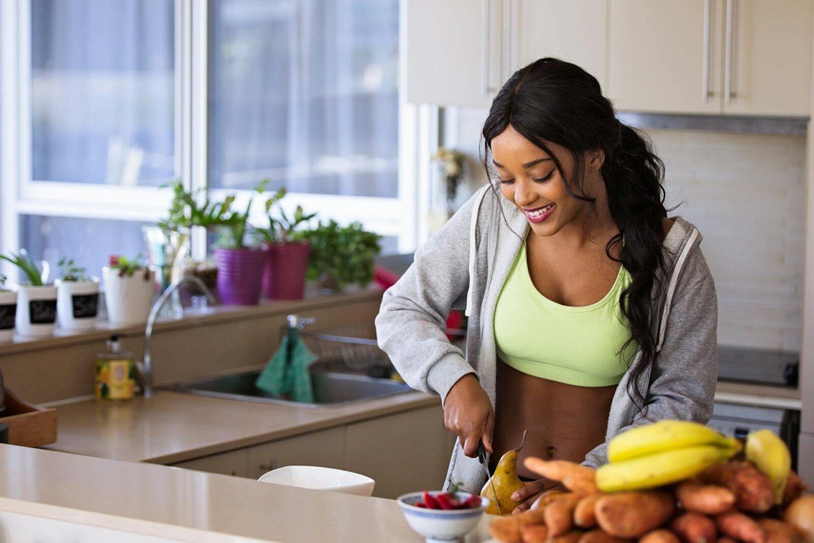 Woman preparing healthy food as part of a toxin-free lifestyle