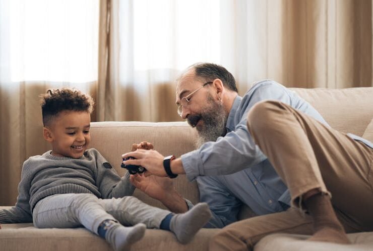 Child playing with grandfather in a warm home setting