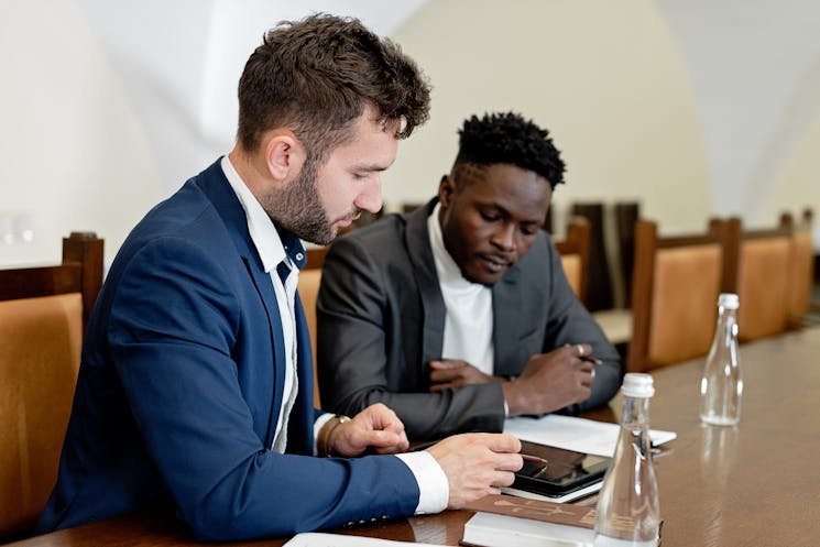 Businessmen discussing personal injury claims in a meeting