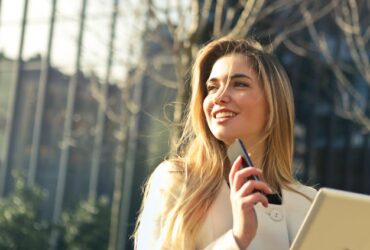 Photo by Andrea Piacquadio - Woman Wearing White Top Holding Smartphone and Tablet finding Real Estate School in Texas