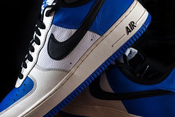 Close-up of blue and white Nike Air Force 1 sneakers with stylish laces