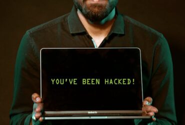 Photo by Saksham Choudhary - Man Holding Laptop Computer With Both Hands