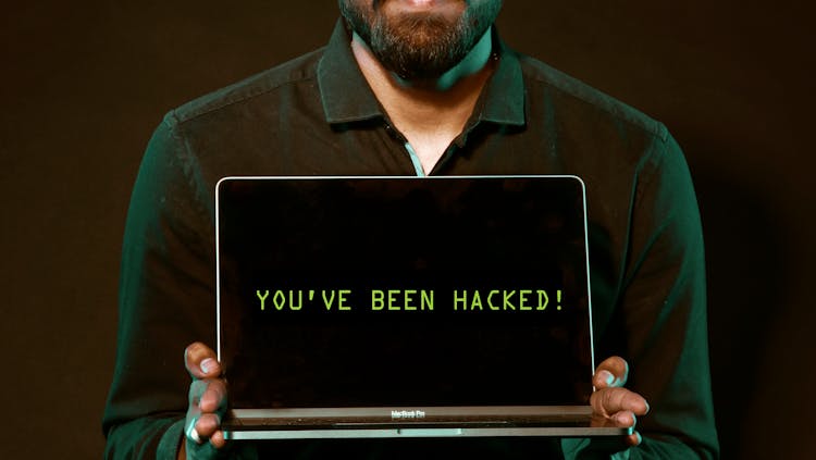 Photo by Saksham Choudhary - Man Holding Laptop Computer With Both Hands