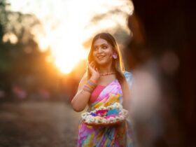 A woman celebrating Holi festival with vibrant colors, symbolizing the rich hues of pitaya powder.
