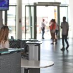 Photo by PhotoMIX Company - IT Manager Sitting Behind Counter Under Television