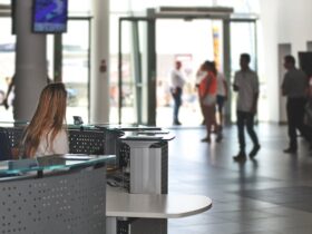 Photo by PhotoMIX Company - IT Manager Sitting Behind Counter Under Television