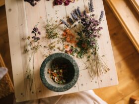 Dried flowers on a wooden table symbolizing natural healing and holistic wellness.