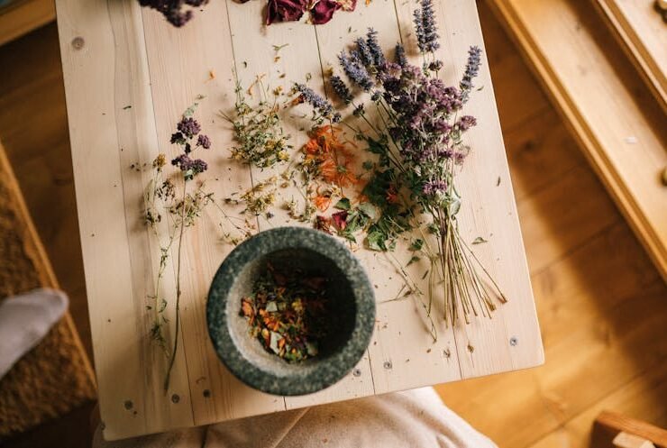 Dried flowers on a wooden table symbolizing natural healing and holistic wellness.