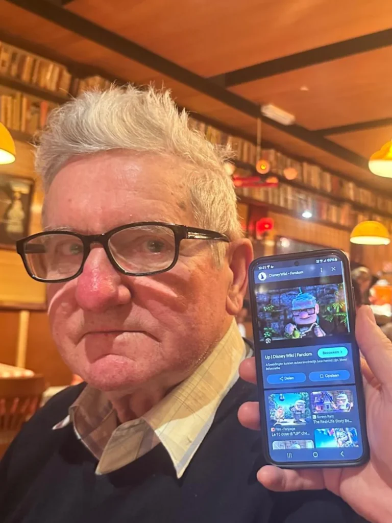 real man with glasses and white hair looking identical to carl from disney pixar up