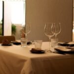 Elegant restaurant table setup with wine glasses