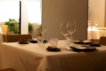 Elegant restaurant table setup with wine glasses