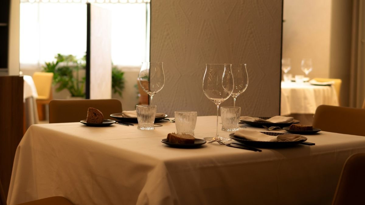 Elegant restaurant table setup with wine glasses