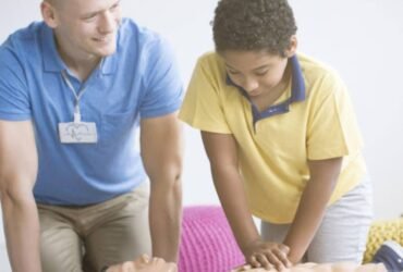 Instructor demonstrating CPR during a first aid training session