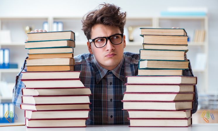 Student with different books representing exam preparation load