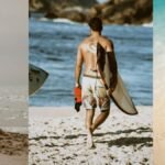 Man enjoying summer escape on a beach with surfboard
