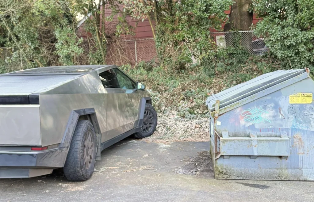 two cybertrucks parked side by side look like futuristic gadgets