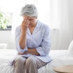 Senior woman sharing a warm conversation with caregiver showing emotional understanding