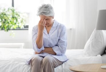 Senior woman sharing a warm conversation with caregiver showing emotional understanding