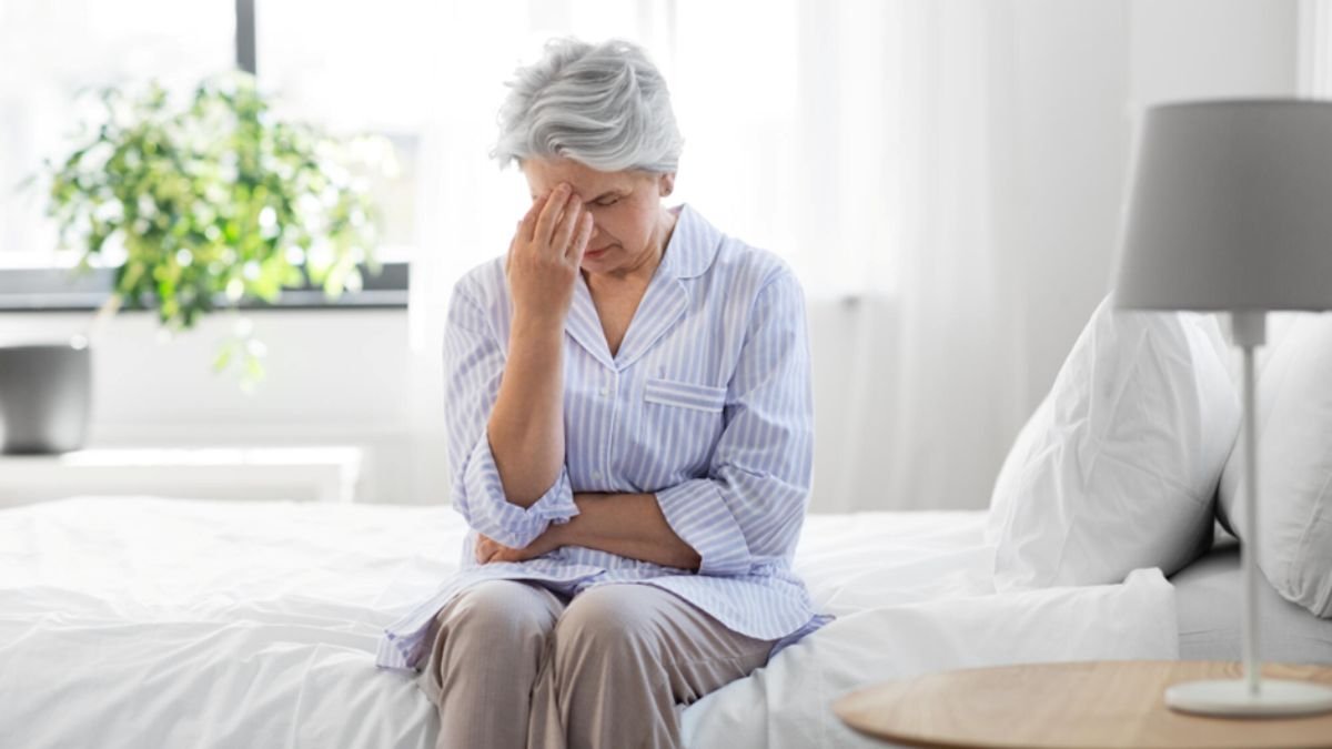 Senior woman sharing a warm conversation with caregiver showing emotional understanding