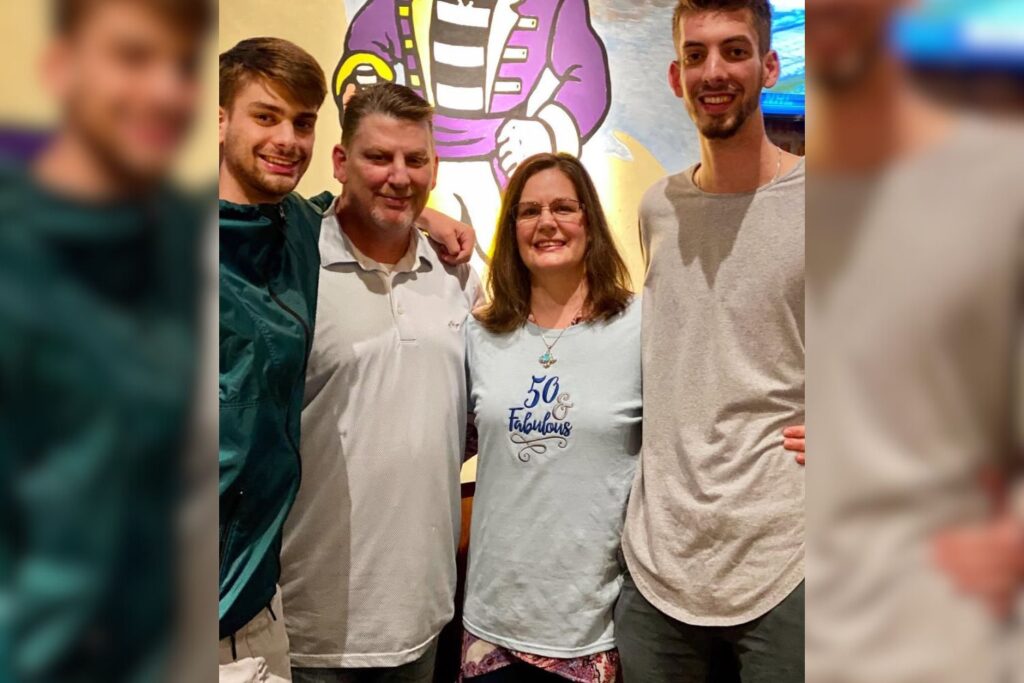 Zach Hallow, Chandler Hallow’s brother, posing with family members. Standing between 6'7" and 6'9" (200 - 206 cm), he is believed to be the tallest person to ever appear in MrBeast’s videos, towering over Chandler and MrBeast in various challenges.